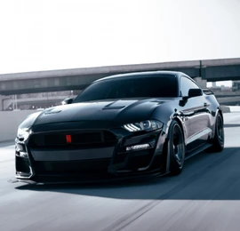 Black muscle car for rent in Dubai